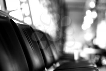 Black and white airport seat with bokeh backdrop hd
