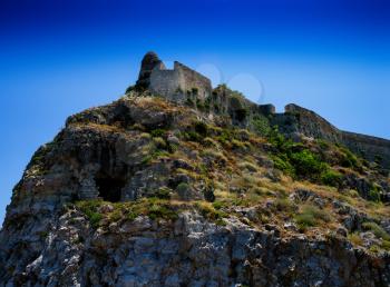 Horizontal vivid abandoned castle on the rock hill landscape background