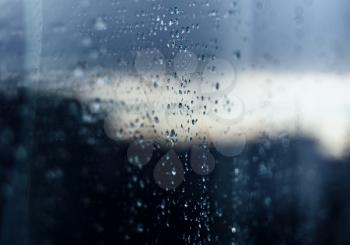 Rain drops on glass reflection