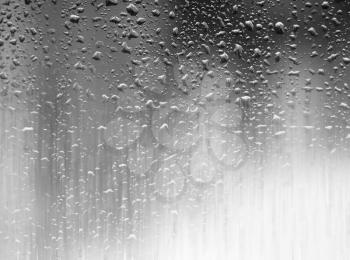 Dramatic raining on the window glass background