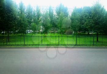 Horizontal symmetric fence near city empty road background