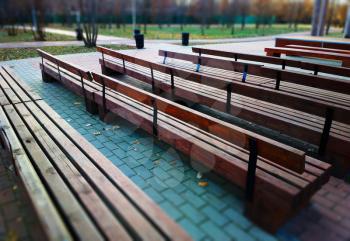 Diagonal park benches landscape background
