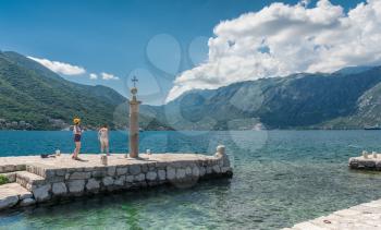Perast, Montenegro - 07.11.2018.  Pier on the island near the old church in the Bay of Kotor, Montenegro