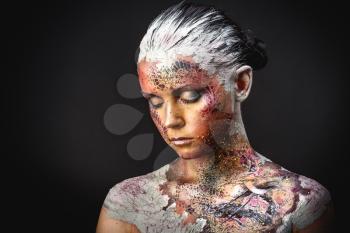 Portrait of Beautiful Young Woman with creative fantasy bird makeup