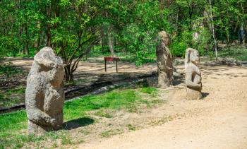 Askania-Nova, Ukraine - 04.28.2019. Ancient stone sculptures in the reserve Askania Nova near Kherson, Ukraine, on a sunny spring day