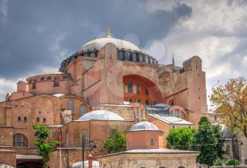 Istambul, Turkey – 07.12.2019. Hagia Sophia museum in Sultan Ahmed Park, Istanbul, Turkey, on a cloudy summer day