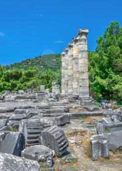 Ruins of the Temple of Athena Polias in the ancient city of Priene, Turkey, on a sunny summer day. Big panoramic shot.
