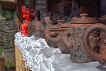 Ornamented pots made of clay. Decorative glassware.