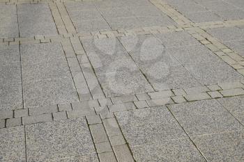 Figure out the paving slabs in the square. Background of paving slabs. Texture of stone products.