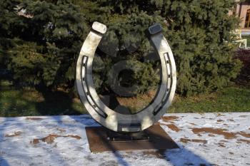 Sculpture of a horseshoe. Symbol of good luck.