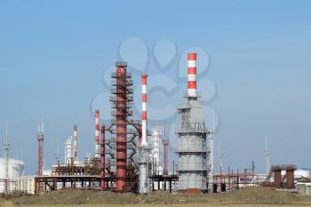 Distillation columns, pipes and other equipment furnaces refinery. The oil refinery. Equipment for primary oil refining.                            