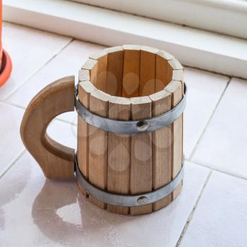 Decorative cup shaped drums. Wooden mug of beer.