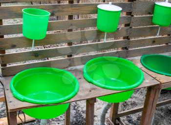 Green washbasin in the yard. Hand wash basin.