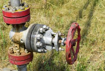 Manual shut-off valve on oil well. Oil well wellhead equipment