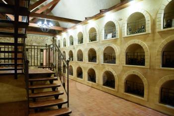 The winery's cellar. Niches in the walls with wine.