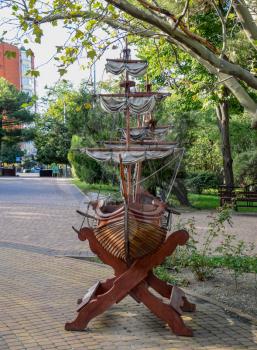 Model of a sailing ship made of wood. Sailing ship