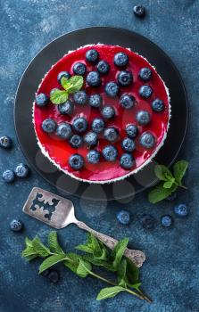 Delicious blueberry cake with fresh berries and marmalade, tasty cheesecake