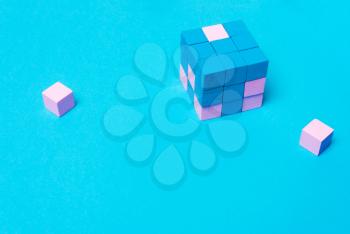 Geometric cube of blue, male and pink female parts. The concept of equality, sexism, feminism, creativity