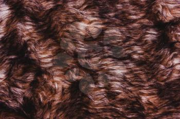 Brown dark warm faux fur texture. Animal wildlife concept