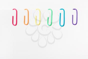 Paper clips of rainbow colors. LGBT flag. copyspace