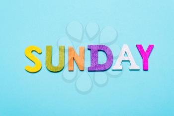Word Sunday made of colorful letters on a blue background