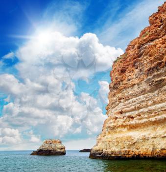 Rock in sea and deep blue sky. Nature composition.