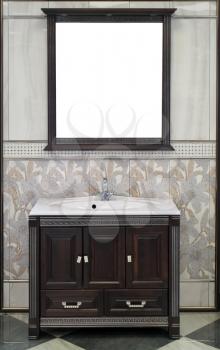 White vanity sink top with sink and a stylish mirror in bathroom interior. 
