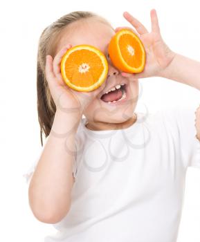 Happy girl with oranges, isolated over white