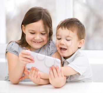 Happy children using tablet computer