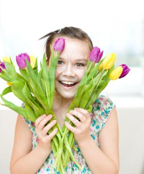 Portrait of the girl with flowers. Spring holiday concept