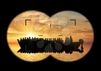 Refugees concept. View from the binoculars on a boat with refugees at sea