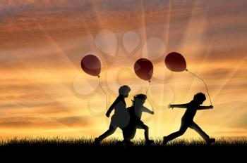?hildren playing sunset on the street with balloons. Happiness and friendship concept