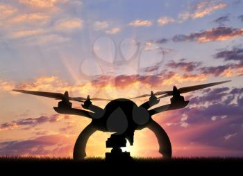 Silhouette drone taking off outdoors. Concept quadrocopters