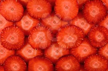 Background juicy cut strawberries. Texture design element