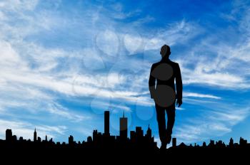 Business concept. Silhouette of man on the background of the city on a sunny day
