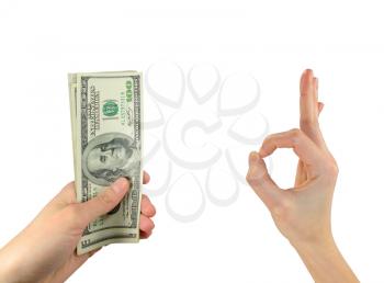 Business and finance concept. Image of dollars in the man's hand, the other hand shows gesture ok. Isolated on white background