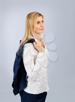 Concept of an office worker. Business woman in a suit on a light background