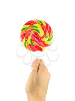 Round lollipop in hand. Isolated on white background