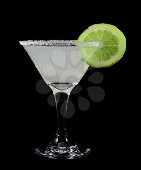 Margarita with a slice of lime fruit on a black background
