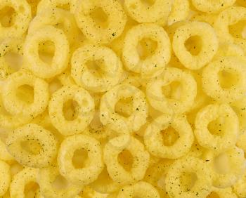 Snacks corn rings. Background macro texture