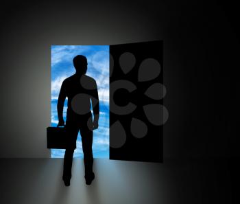 The concept of new business opportunities. Silhouette of businessman standing in front of open doors