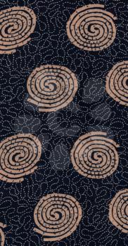 Beautiful dark fabric with a spiral pattern.