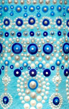 Spot painting. Dot Art. Close-up texture. Pattern on a blue background.