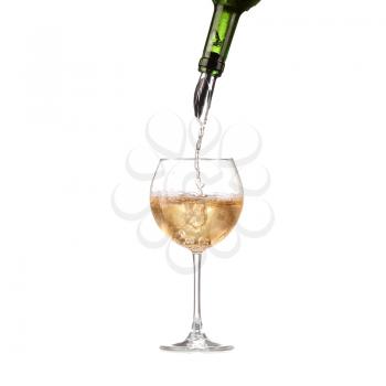 Wine in glass pouring from bottle and make splash, dispenser on the bottle