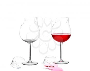 Two broken glass and empty with red wine on white isolate