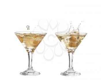 collage Splash from olive in a glass of cocktail, isolated on the white background, clipping path included.
