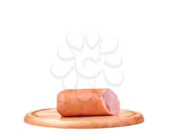 Large piece of ham with cut slices on wooden platter, isolated on white background