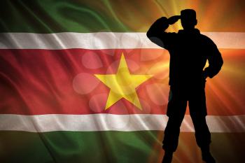 Flag with original proportions. Closeup of grunge flag of Suriname