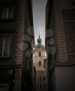 A view of the ancient tower from the alley. Warsaw, the old city. Heart of history
