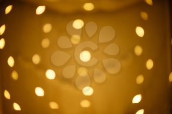 Abstract circular reflection of christmas lights on background.Holiday Christmas scene. Christmas gifts under the Christmas tree